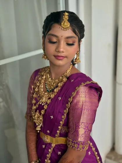 A beautiful profile shot showing the soft, shimmery eyeshadow and perfectly blended base. This look was designed to be both traditional and modern.