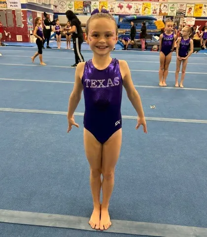 A young Level 3 gymnast strikes her pose at the South State Championships.