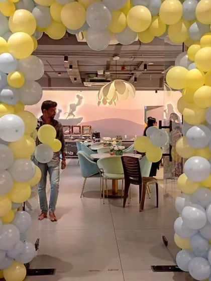 A Minions-themed party is always a hit with the kids. Here, we've created a fun and vibrant balloon arch using the signature yellow and blue colors to set the stage for a playful and memorable second birthday celebration.