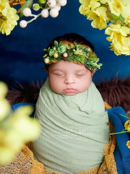 Wrapped in green and framed by yellow flowers. This overhead shot creates a beautiful, symmetrical portrait that is full of life and color.