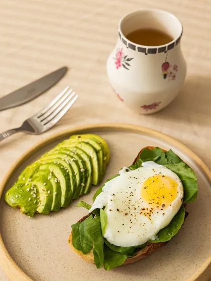 A closer look at our popular Avocado Egg Toast. We use fresh sourdough bread, perfectly ripe avocados, and a fresh egg to create a breakfast that is both delicious and nutritious.