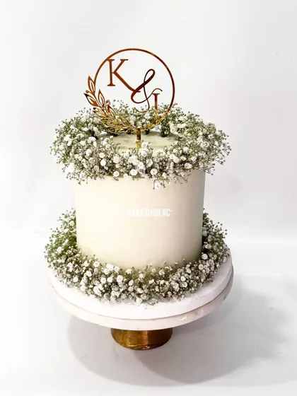 The perfect intimate wedding cake. This is a 2kg eggless Chocolate Mousse cake, which is lighter than a truffle cake but just as delicious, decorated with baby's breath.