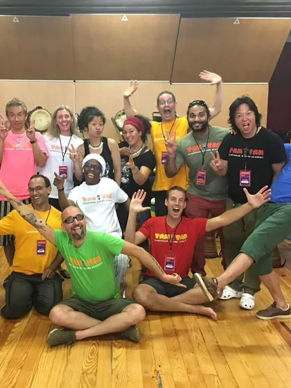 A photo from an international gathering of TTMDA teachers and students, all united by the teachings of Mamady Keïta. It's a global family connected by rhythm.