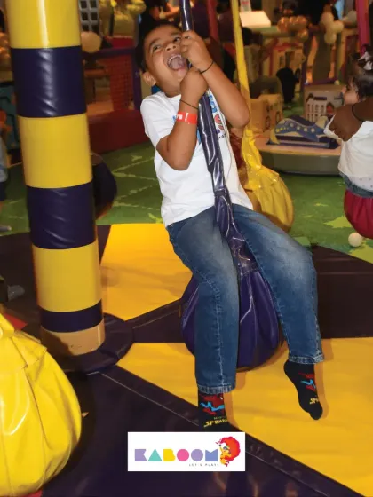 This little adventurer is having a blast on our pendulum swings, a thrilling ride for energetic kids.