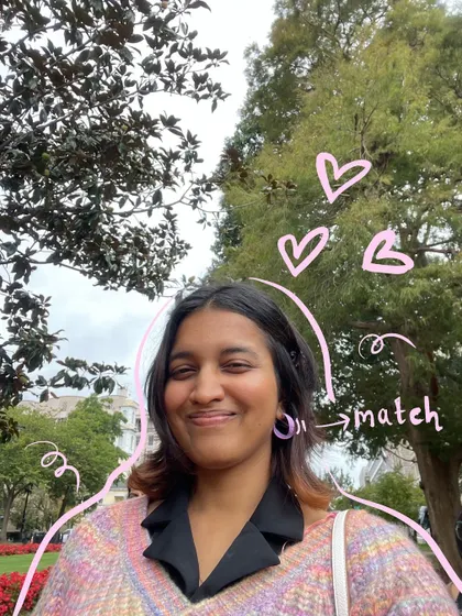 A close-up selfie showing my matching earrings, with doodles to point them out and add some love.