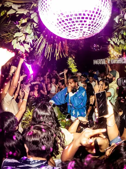 Under the disco ball at Mother Dance, where the magic happens. This shot perfectly captures the immersive, vibrant atmosphere we create, a space for everyone to feel free and connect.