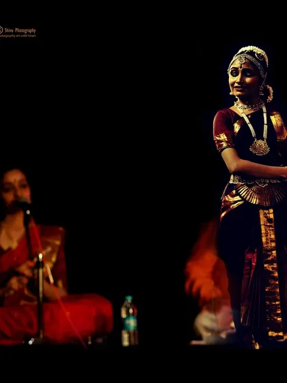 A candid moment on stage during my student's Rangabhivandane. The live musical ensemble is essential for a complete performance, and I ensure my students have this opportunity.