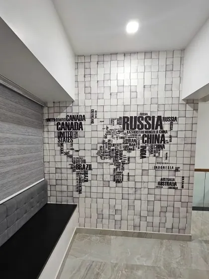 A world map made of typography on a 3D block pattern wallpaper. This is a creative and modern design, perfect for a study, office, or for anyone with a love for travel.