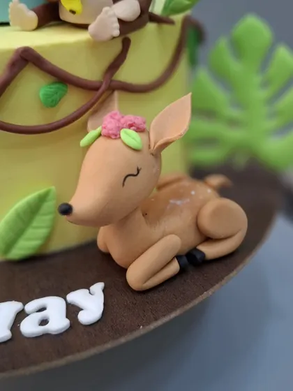 A close-up of the sweet, sleeping deer figurine.