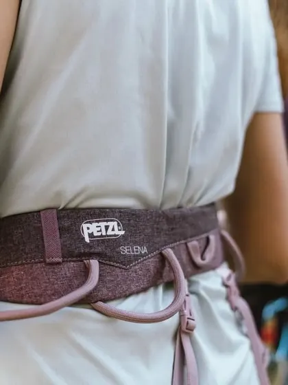 A participant wearing a Petzl harness. We ensure everyone is fitted correctly and understands how to use their gear before climbing.
