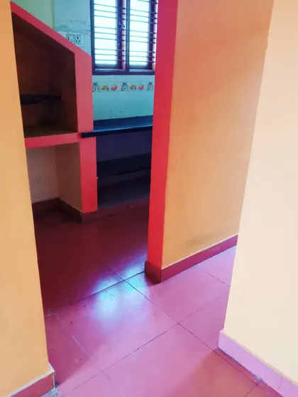 Looking from the hallway into the kitchen area of a recently completed project. The client chose a vibrant color scheme that we applied carefully across different walls and structures.