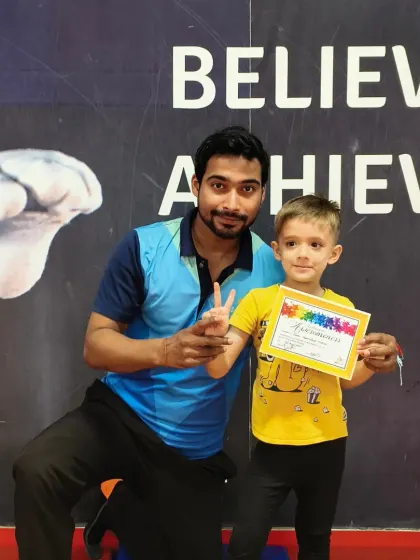 Another happy gymnast with his new certificate. These awards are a key part of how we track progress and keep our students excited about their fitness journey.