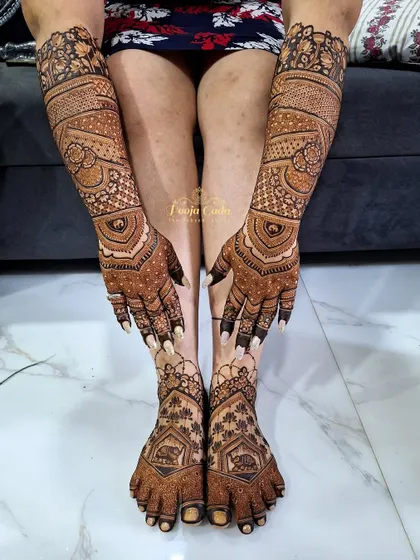A stunning bridal back and legs design done by the team, featuring intricate patterns and beautiful elephant motifs.