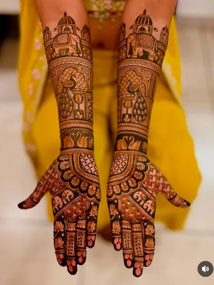 A majestic design rich with peacock and elephant motifs. The layering of different patterns creates a sense of depth and grandeur.