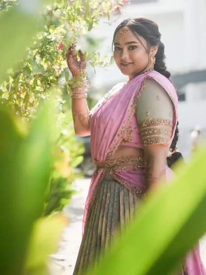 A lovely candid shot of the client in her custom half saree.