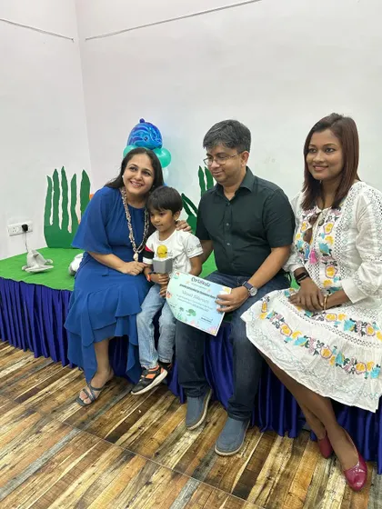 It's a family affair! A student, along with his proud parents and me, celebrating his successful performance and participation in our ocean-themed workshop.