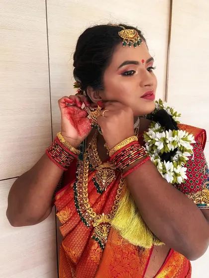 This shot captures the essence of a bride getting ready, providing a natural and beautiful perspective on the final look.