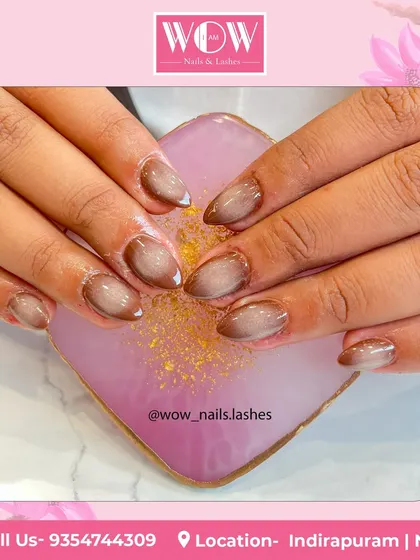 A beautiful ombré design in shades of brown and nude. The soft gradient effect on these almond-shaped nails is both sophisticated and on-trend.