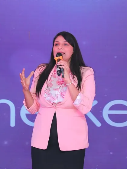 Addressing the audience at AccelHERate. I use storytelling to connect with younger audiences and make complex topics more engaging.