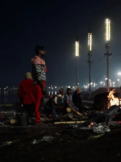 Under the cover of night at Manikarnika Ghat in Varanasi, funeral pyres burn brightly against the dark waters of the Ganges. My approach to documenting these sacred rites is quiet and respectful, focusing on the atmospheric reality of the scene.