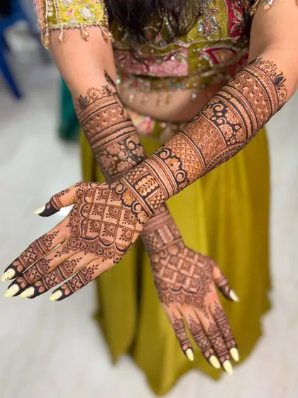 A crossed-arm pose of the same design, showing the full, glorious detail.