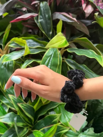 The black velvet scrunchie is a timeless classic. It’s a staple accessory that’s both practical and stylish, handmade with soft, high quality yarn.