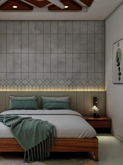A contemporary bedroom with a unique geometric-patterned false ceiling. The accent wall behind the bed features concrete-finish tiles and a backlit headboard, complemented by modern pendant lights for a chic, industrial look.