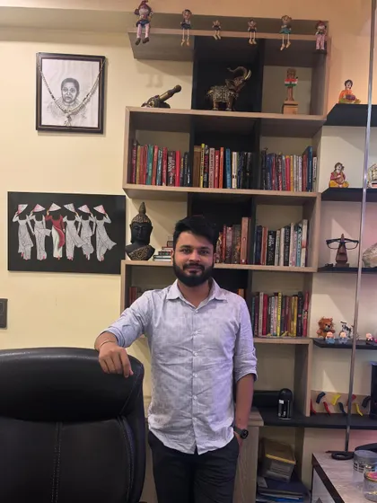 Standing in my cabin, surrounded by books and mementos that inspire me. Continuous learning is essential in the world of finance to provide the best tax advisory services.
