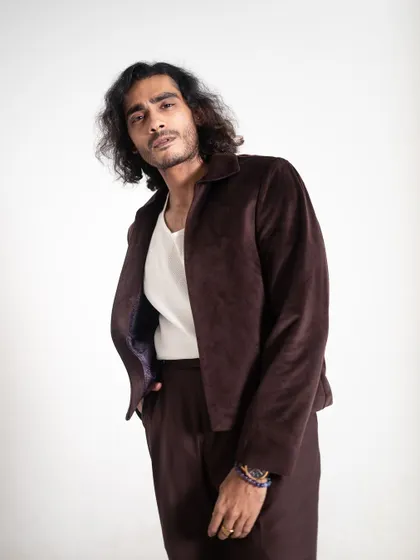 A close-up of the velvet jacket, showing its texture and fit.