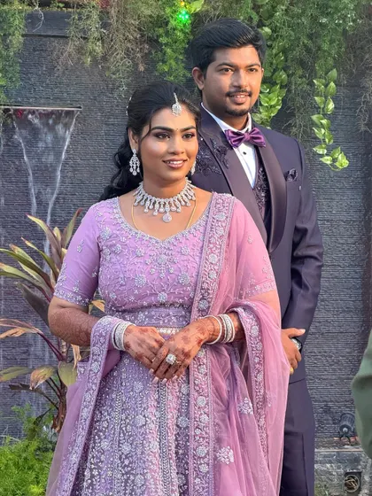 A happy couple shot from Aparna's reception. The makeup is designed to look flawless and beautiful in all her wedding photos.
