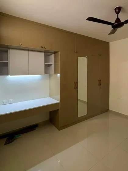 A collection of photos from a 2BHK transformation, accompanied by a thrilled client's review.