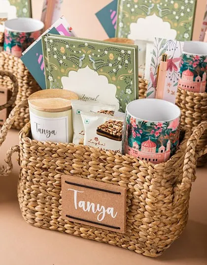 A personalized hamper in a Kauna basket, perfect for bridesmaids or special friends. The natural texture of the basket pairs beautifully with the custom stationery and curated items inside.