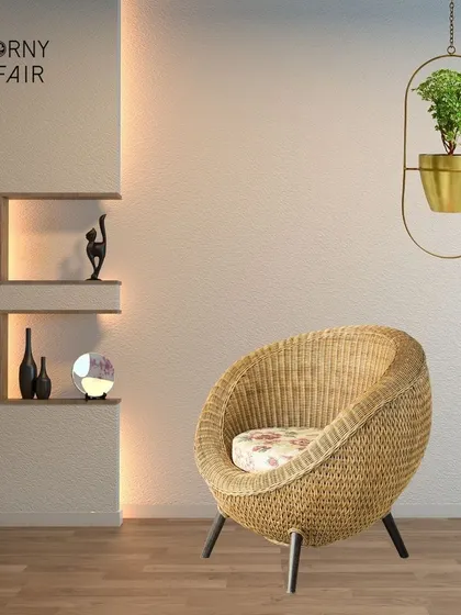 Elevate your greenery with a hanging metal planter. This piece, with its elegant gold finish and modern design, is perfect for adding a stylish accent to a quiet reading corner.