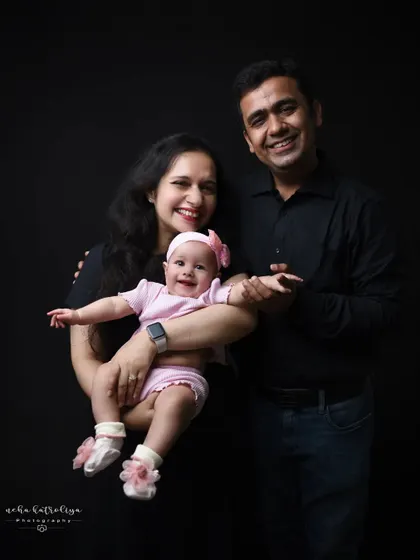 A lovely portrait of a mother and father with their baby girl. The mother holding the baby creates a slightly different dynamic and a beautiful "Mumma and me" moment within the family photo.