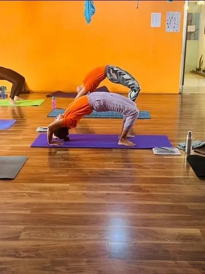 Awaken your inner warrior in our empowering group classes. These shots from our studio show students moving together, creating a powerful collective energy.