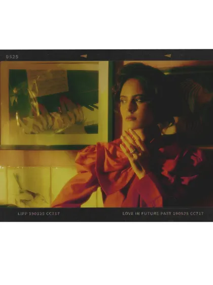 This shot is framed to look like a vintage film slide, reinforcing the cinematic and nostalgic themes of the "Love in Future Past" editorial.