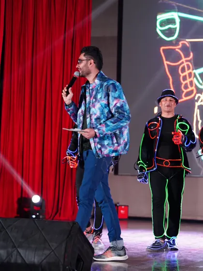 A side profile of me interacting with the performers on stage. Coordination with artists is key to a seamless show flow.