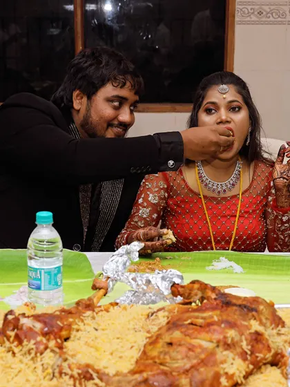 A tender moment between the couple as they share a meal. Our goal is to provide a feast that brings people closer together.