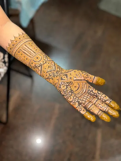 This is a detailed view of my intricate bridal henna work. Each design is unique, combining traditional patterns like paisleys and mandalas with fine-line fillers to create a stunning, full-coverage look for your special day.