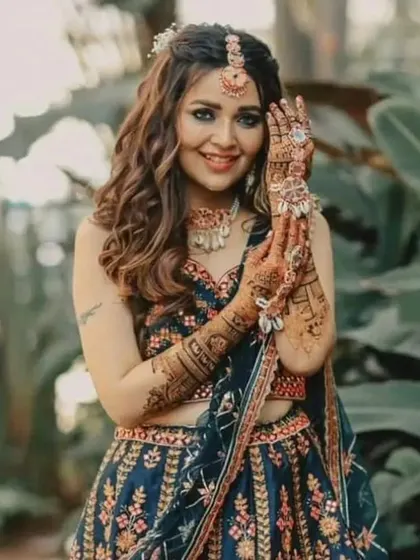 A gorgeous professional shot of a bride, her intricate mehendi perfectly complementing her stunning bridal look.