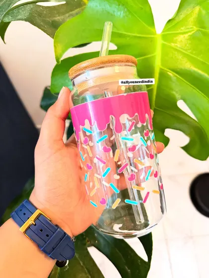 This glass sipper with a pink drip and sprinkles design looks good enough to eat.