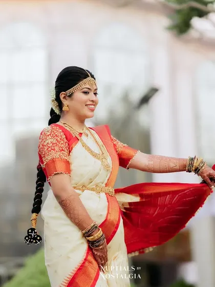 The bride twirling her saree. The makeup and hair are securely set to withstand all the fun and movement of the day.