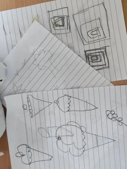 Every great design starts with a sketch. Before we even touch the paints, I help everyone brainstorm and draw their ideas on paper, planning out the design to make sure it looks great on the final product.