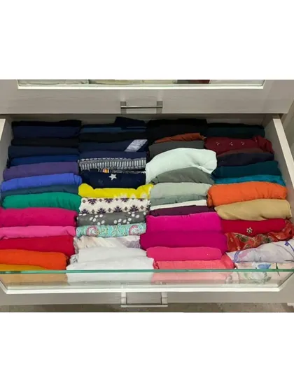 File folding is a game-changer for drawers. Look how every t-shirt and top is visible, making it easy to pick one without disturbing the rest of the pile.