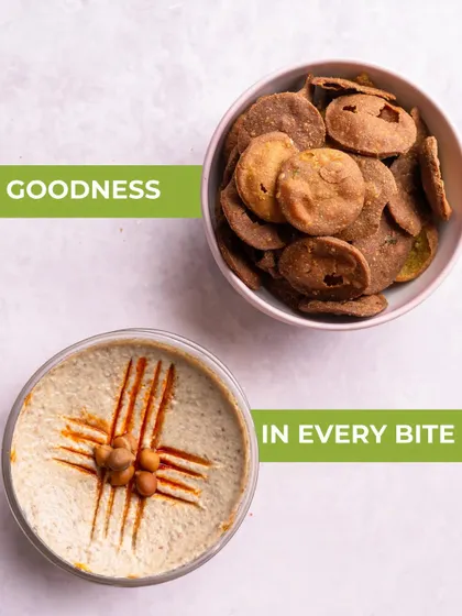 Goodness in every bite. This image showcases the perfect pairing of my Bajri Wada with creamy hummus, a quick and fulfilling snack combo.