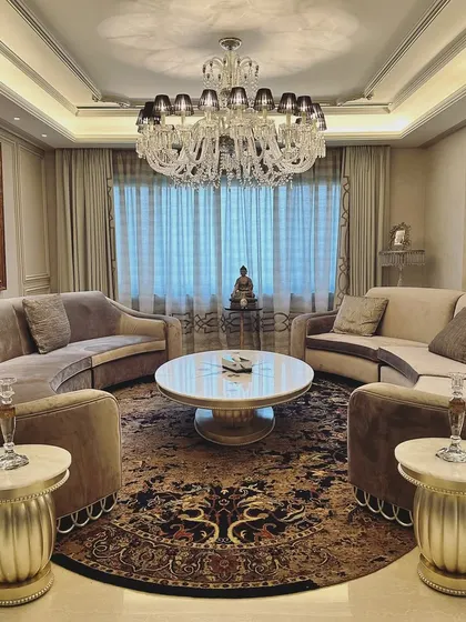 This living room was a special project, redesigned a decade after our initial work. We upcycled many original high-quality pieces, blending them with new elements to create a fresh yet familiar space that tells the continuing story of the homeowners' lives and aspirations.