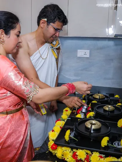 The ritual of boiling milk on the new stove is a key moment in a housewarming ceremony, symbolizing prosperity. We capture these detailed traditions up close.