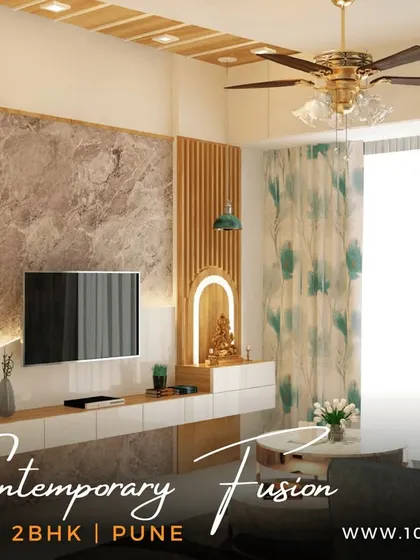 The living room of our 'Contemporary Fusion' 2BHK project in Pune. We used a mix of textures, including a marble-finish TV panel and wooden fluting, to create a space that is modern yet full of character.