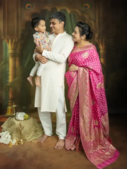 A candid moment during a traditional family maternity shoot, filled with smiles and anticipation for the new arrival.