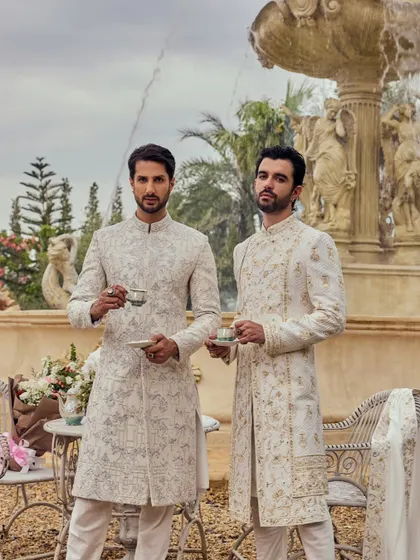'Amore' is made for the men who wear their heritage with pride. These two coordinated ivory sherwanis, with their distinct embroidery, are a testament to that philosophy.
